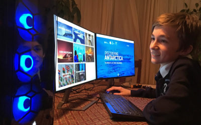 A person standing in front of a computer.