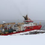 A boat that is sitting in the snow