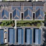 Aerial photo of a range of buildings with solar PV