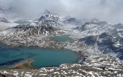 An areal image of a snow covered mountain