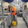 A man standing next to a machine